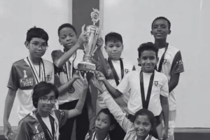 Kids holding a trophy